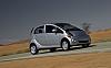 2012 Mitsubishi i-2012-mitsubishi-imiev-front-three-quarters-motion.jpg